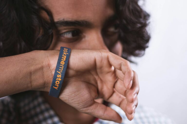 Senior wearing a medical alert wristband at home
