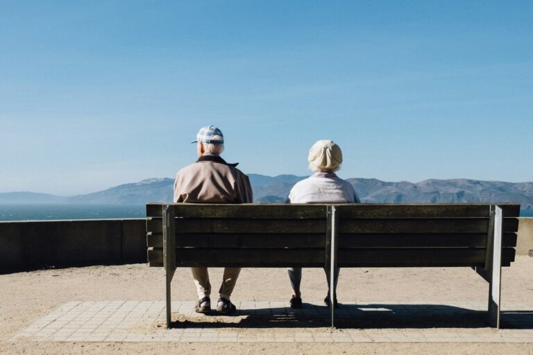 Older adult sitting alone in quiet solitude at home